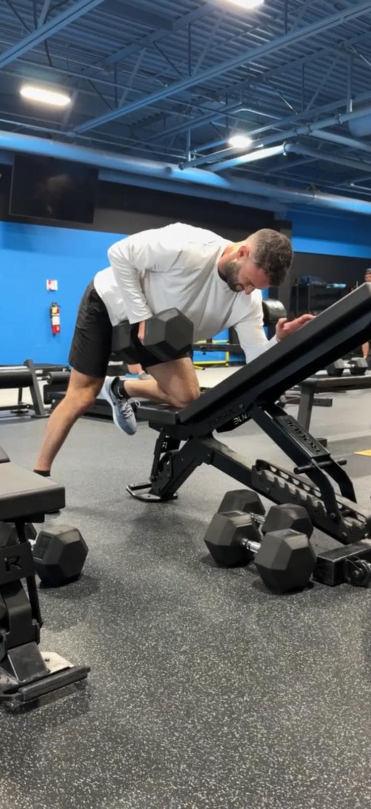 Athlete performing a supported dumbbell row at Phyx Performance